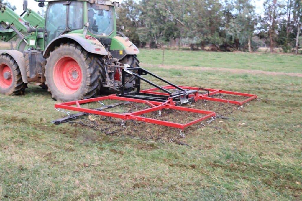 Redback 3pL Hydraulic Folding Harrow with tractor in field