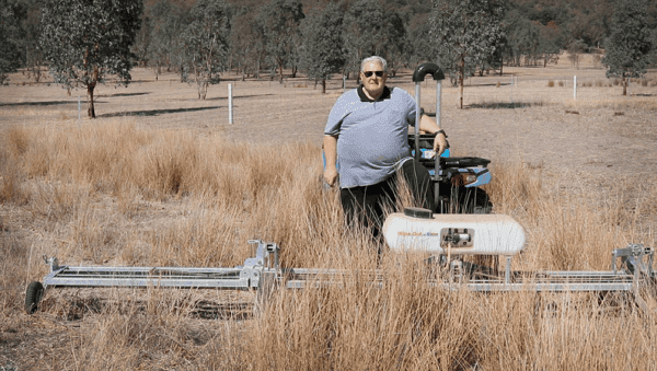 Farmer Bill Stubbs demonstrating the Redback Weedwiper in action
